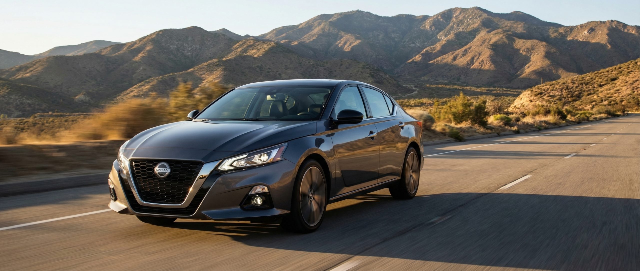 Silver Nissan Altima cruising on CA-74 toward Hemet.